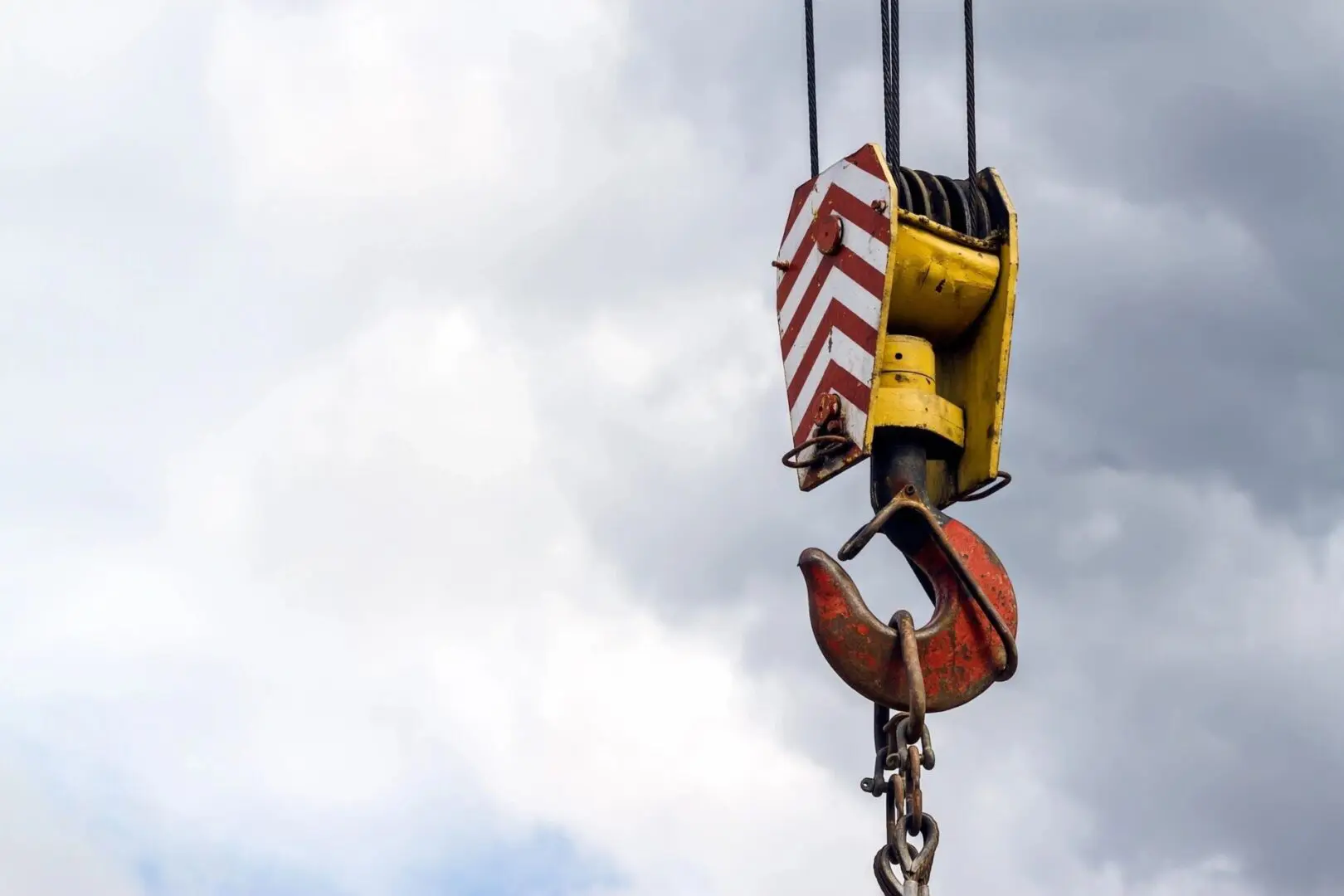 A crane with a hook attached to it